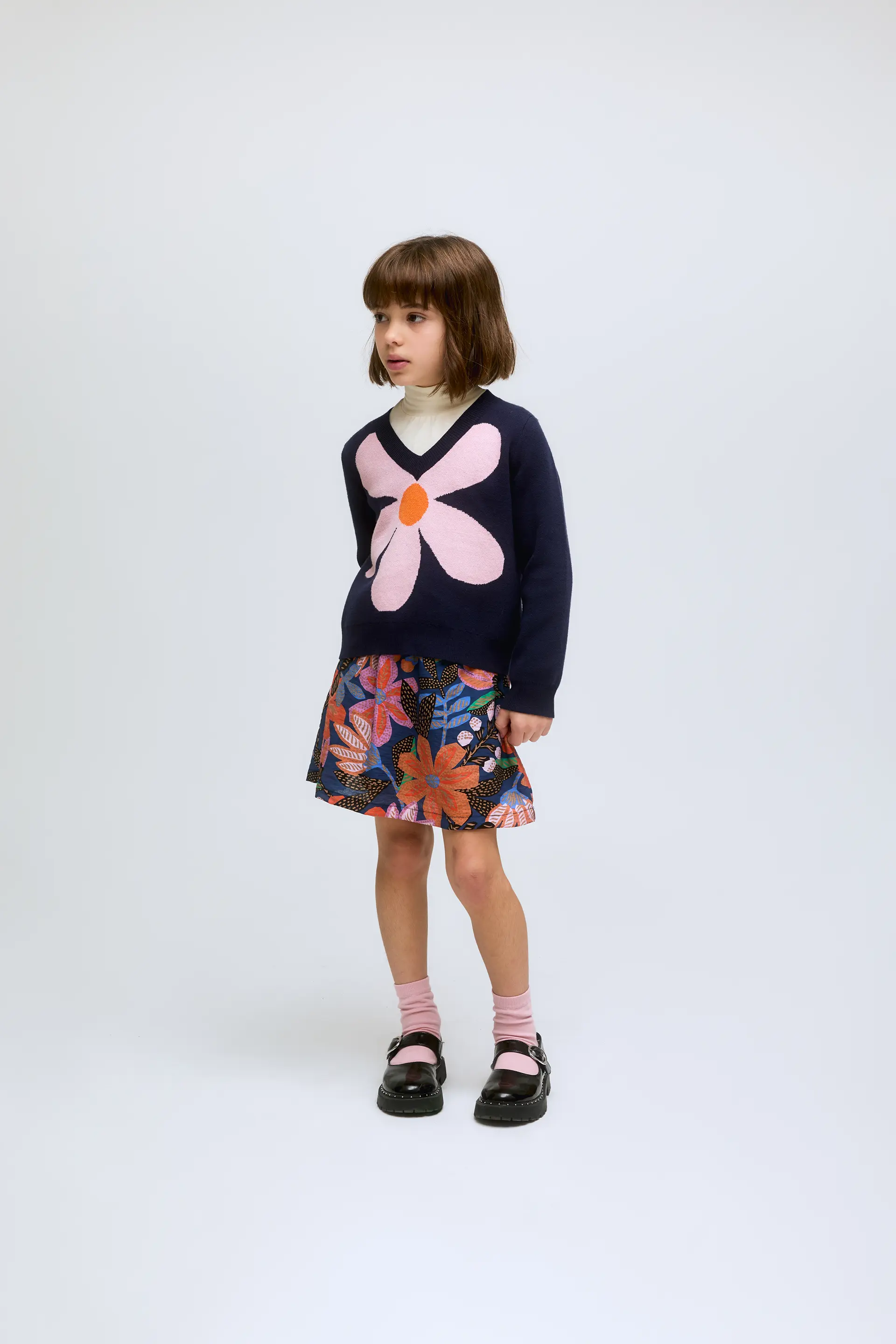 Jersey de niña de punto azul marino con print de flor