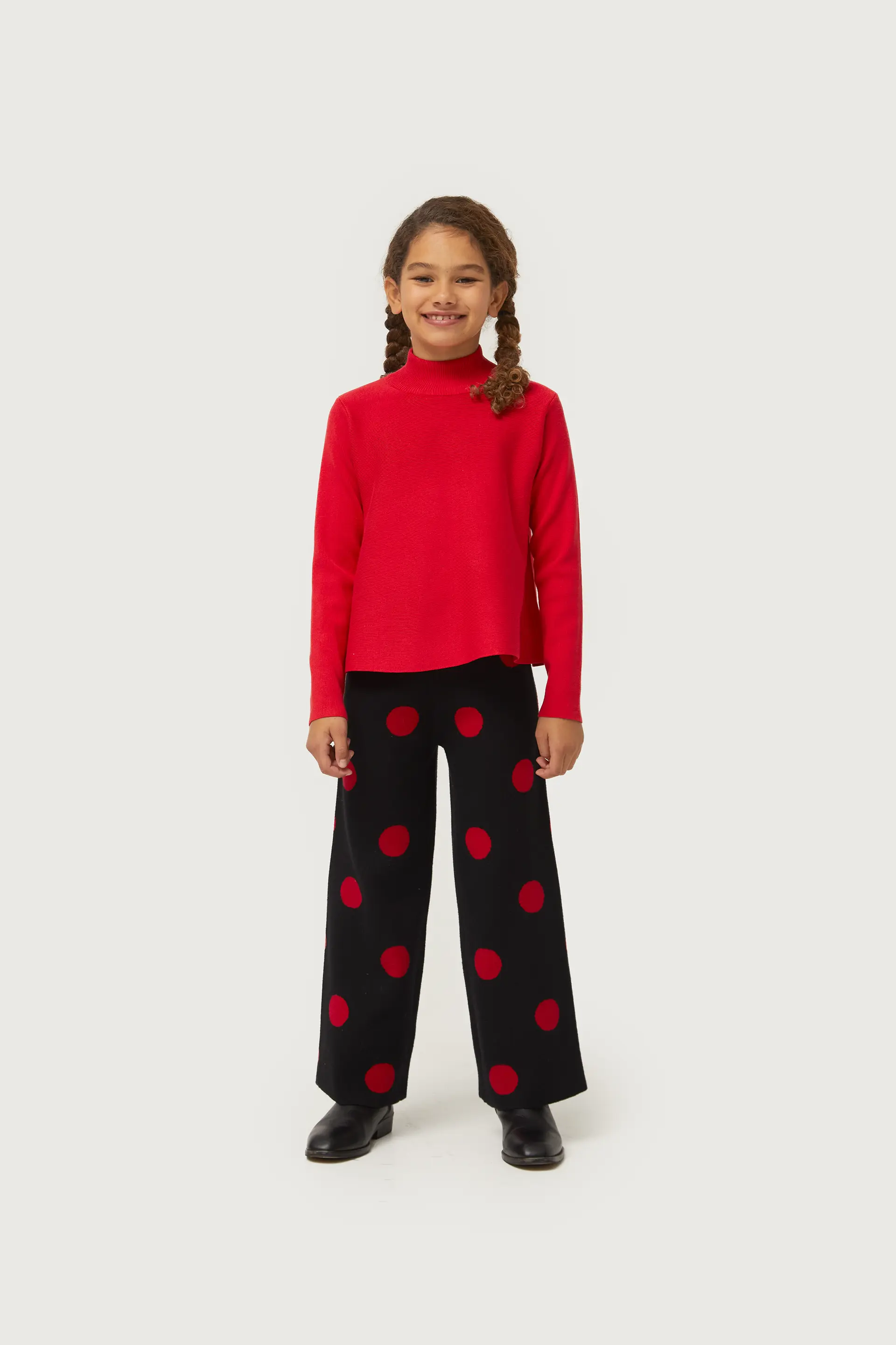 Pantalón de niña de punto jacquard estampado de lunares rojos